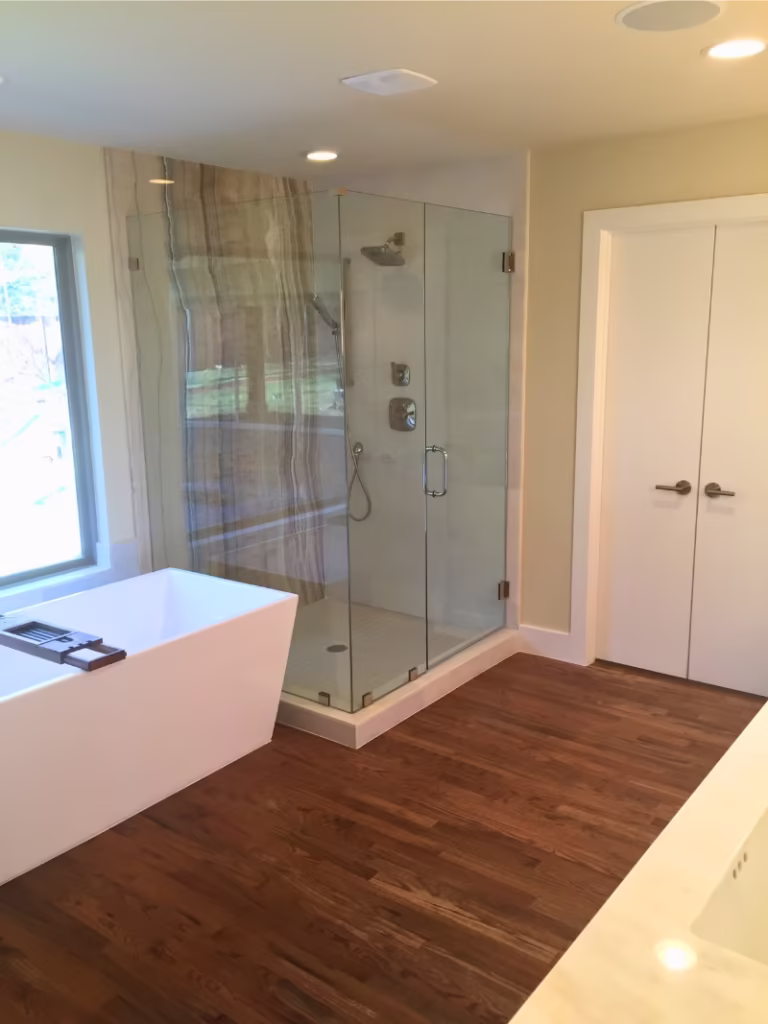 Custom bathroom completed by Douglas Allen Homes featuring a remodel on a custom shower and bathtub.